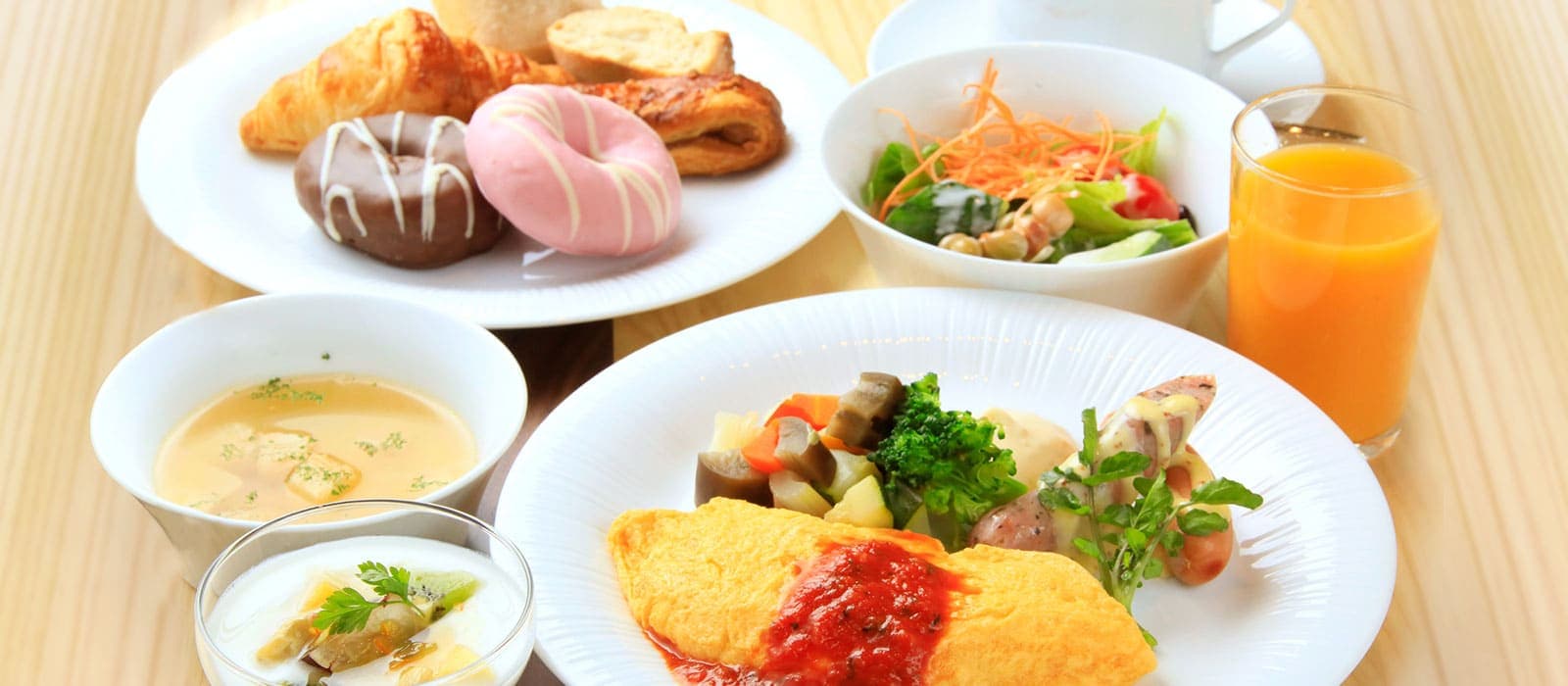 Western and Japanese buffet breakfast with omelet, pastries, salad and fresh juice