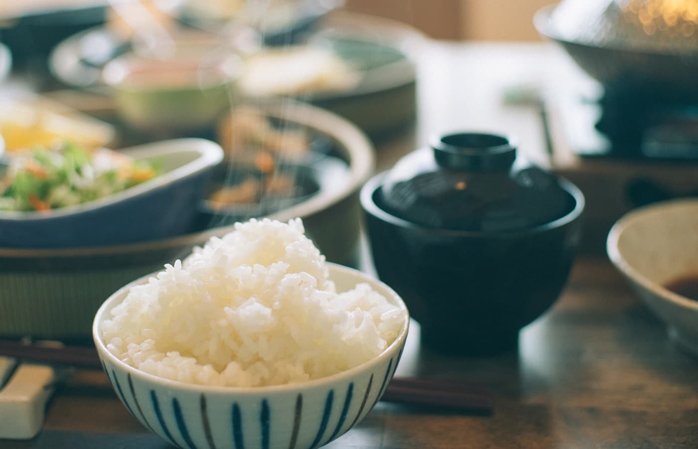 Japanese breakfast at Hakuba Marukin Ryokan with steamed rice, pork-and-vegetable miso soup and pickles