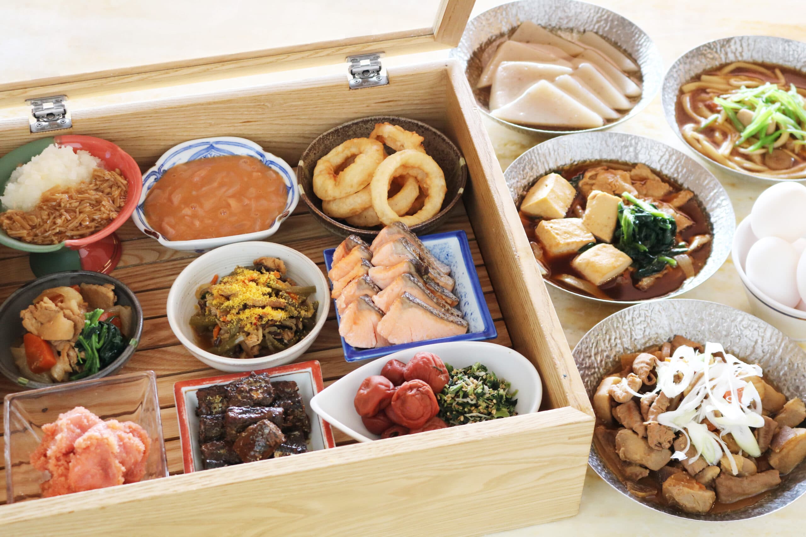 Japanese breakfast box set at Hotel Village with grilled salmon, simmered dishes, pickles and miso soup