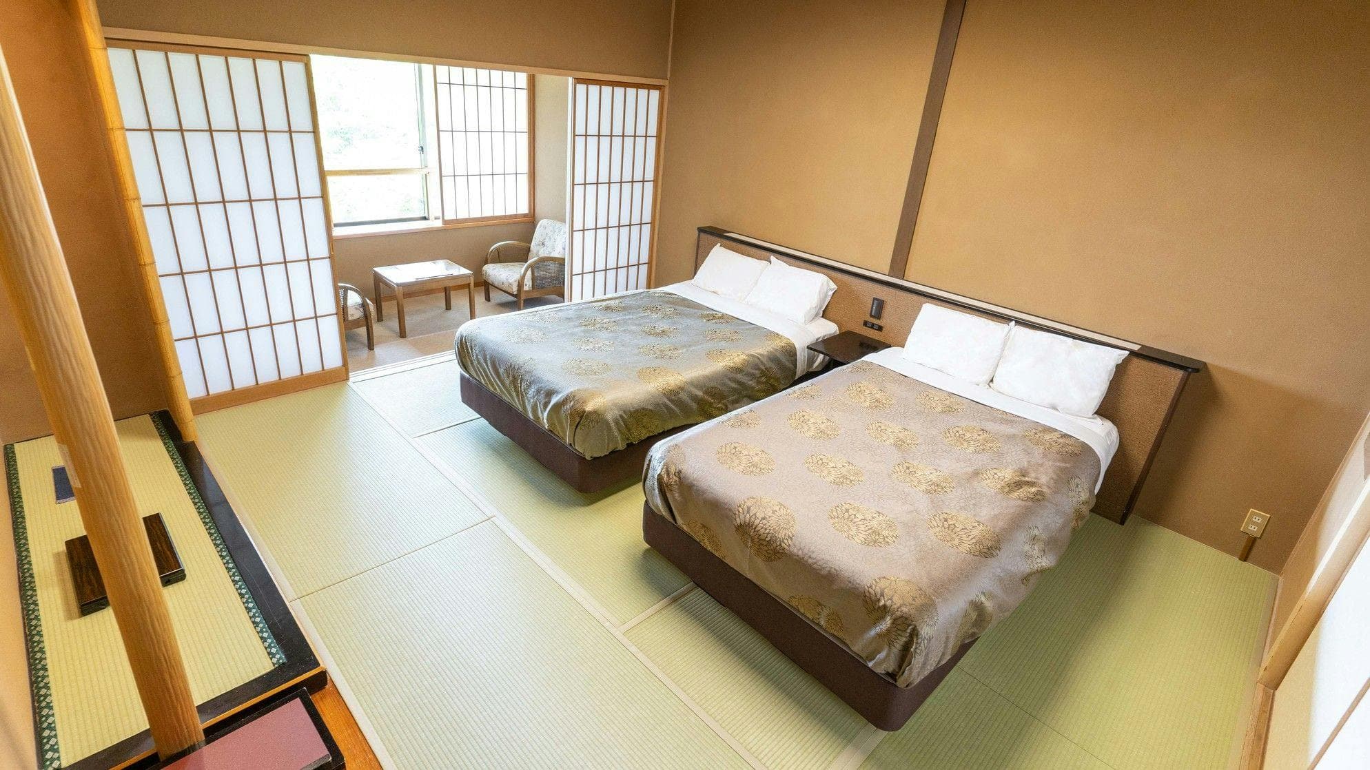 Tatami guest room with two beds and shoji screens