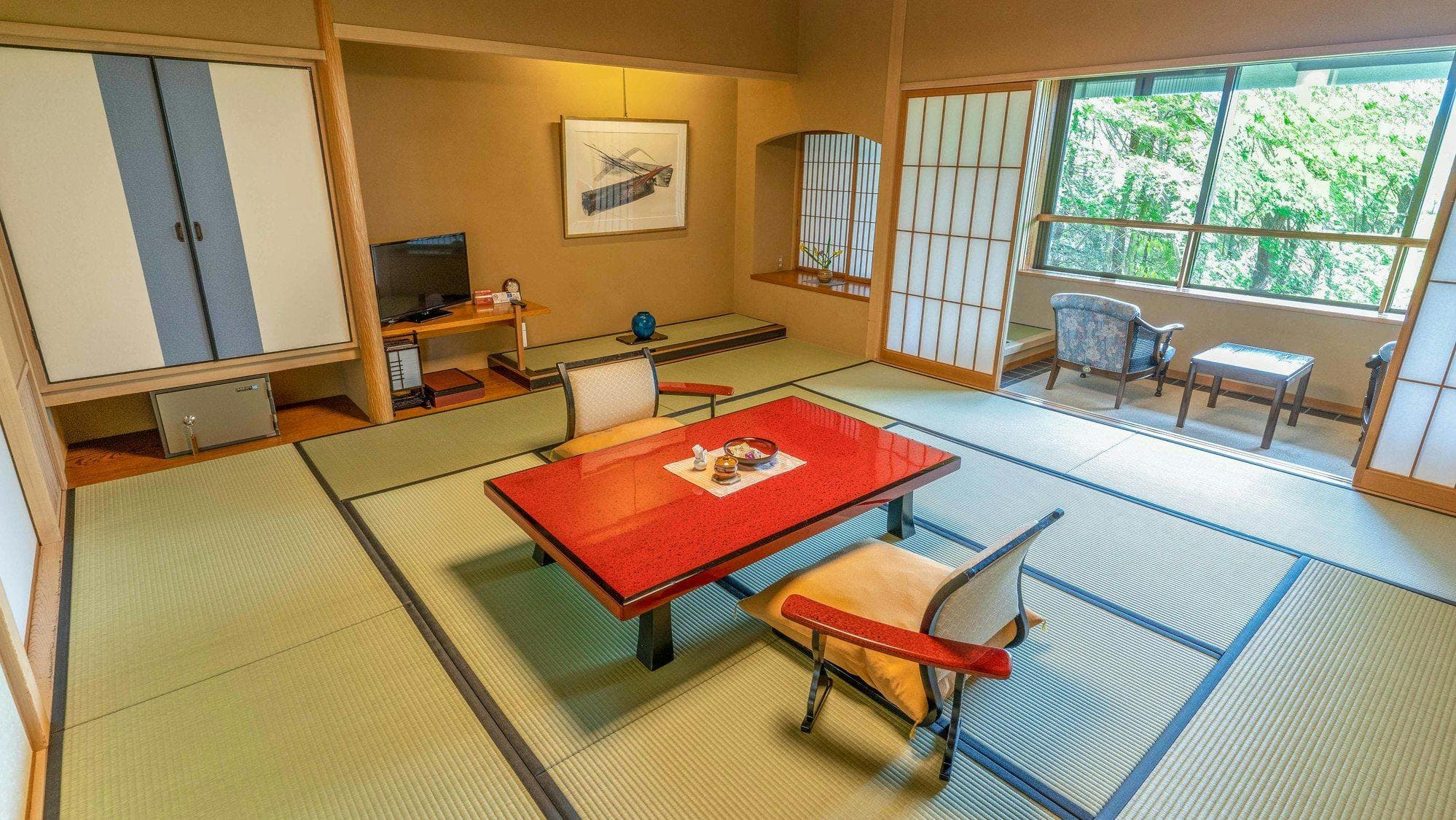 Traditional tatami room with red lacquer table and garden window