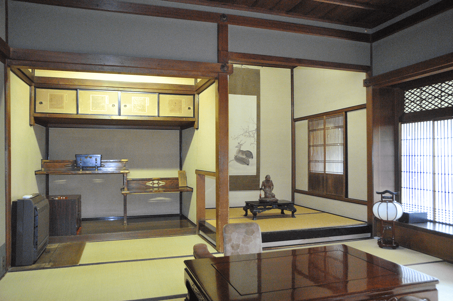 Premium Daigo tatami guest room at Kankaso ryokan in Nara with tokonoma alcove, hanging scroll and traditional wooden ceiling