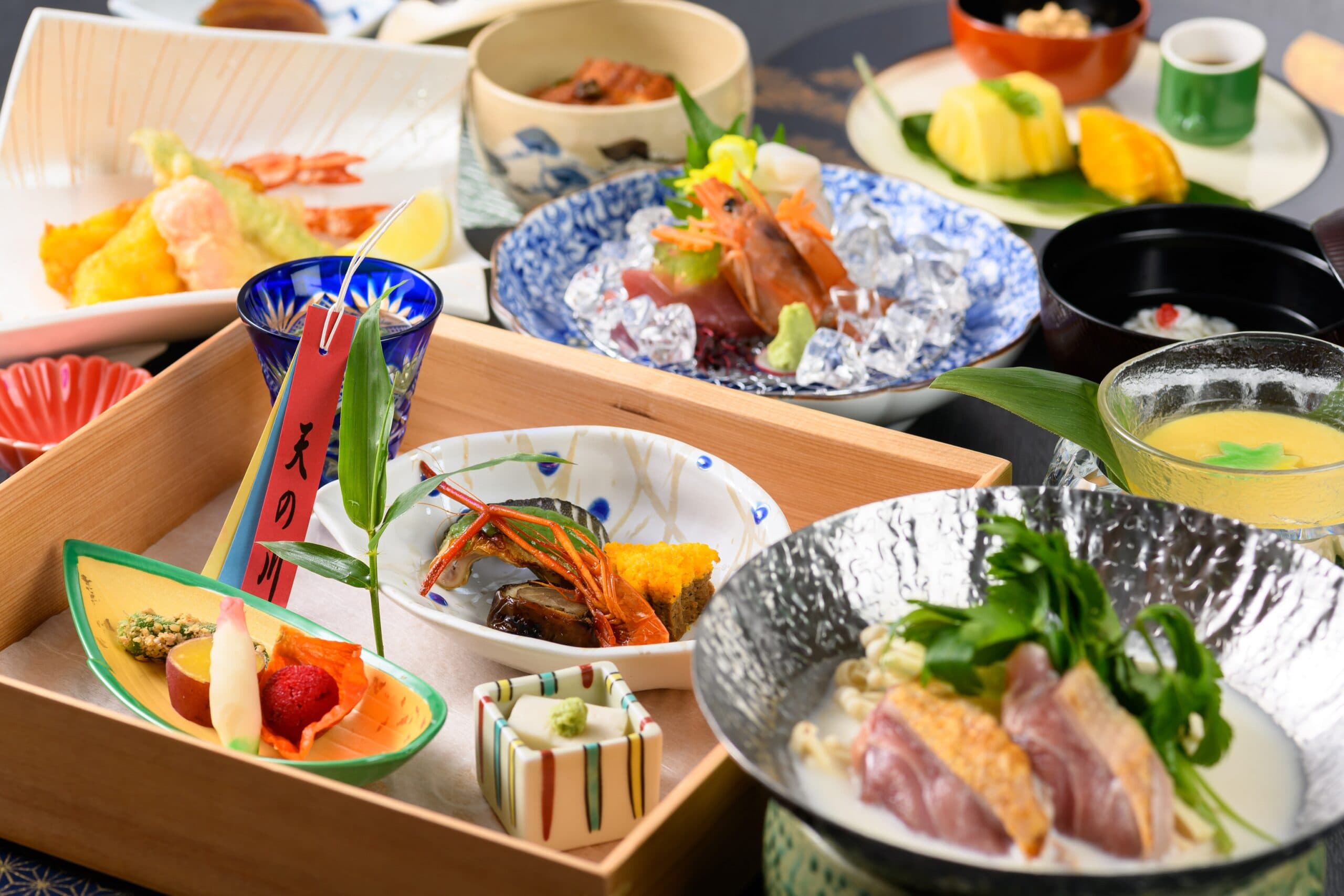Full kaiseki course spread with tempura, sashimi and assorted small dishes at Kasuga Hotel in Nara