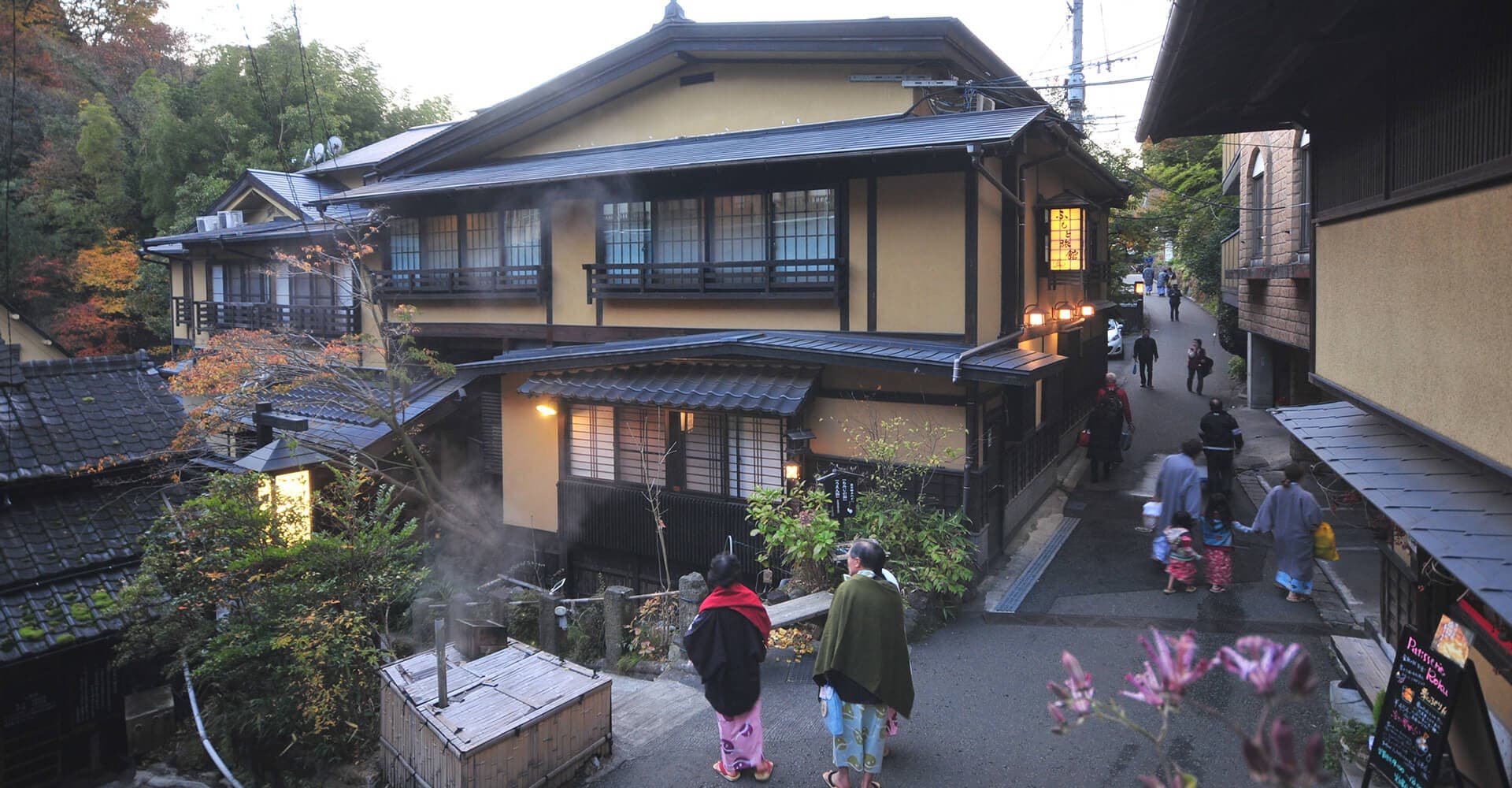 Exterior view of Ryokan Kounoyu nestled in the Kurokawa Onsen valley