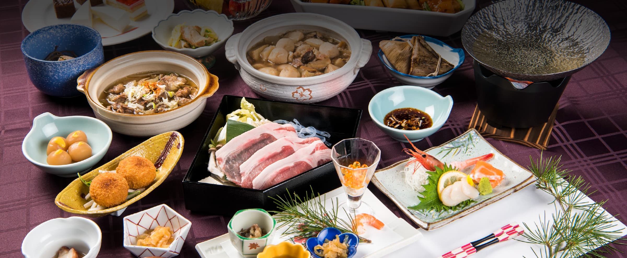 Multi-course kaiseki dinner spread with hot pots, sashimi and seasonal small dishes at Meitoya So