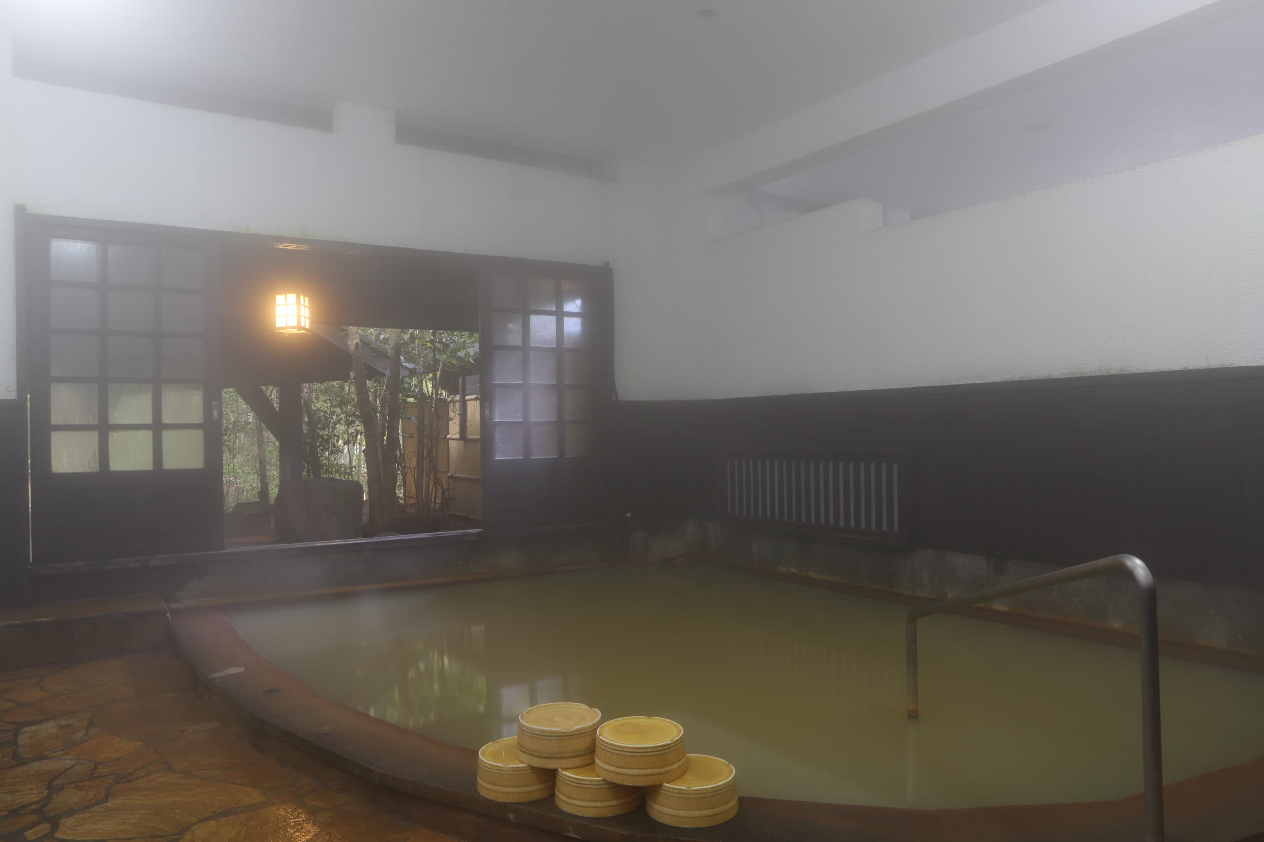 Ryokan Wakaba indoor milky hot spring bath with wooden basins