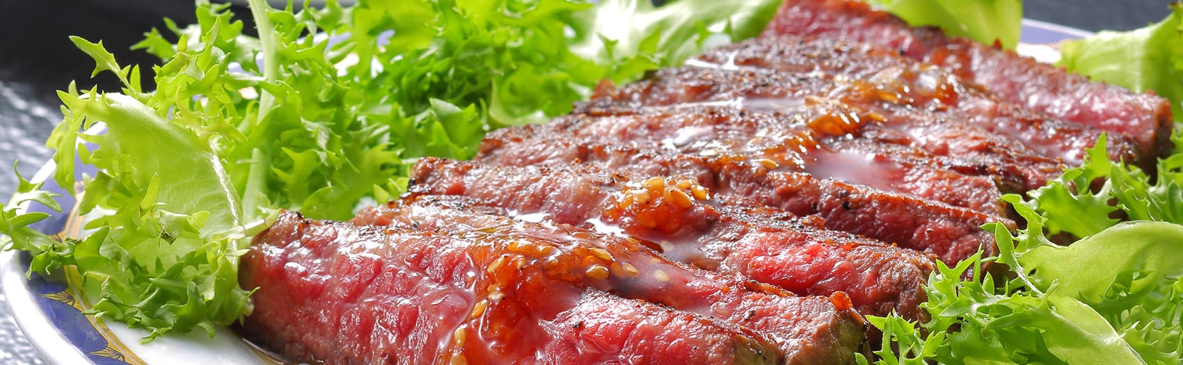Plated grilled sliced beef steak with fresh greens served at Hotel Sunshine Kinugawa, Kinugawa Onsen dinner
