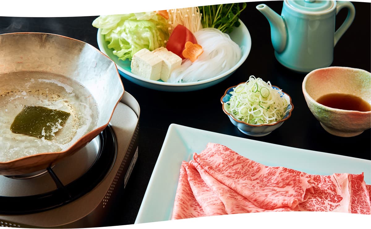 Wagyu beef shabu-shabu hot pot set at Kozantei Ubuya with fresh vegetables, tofu and dipping sauce