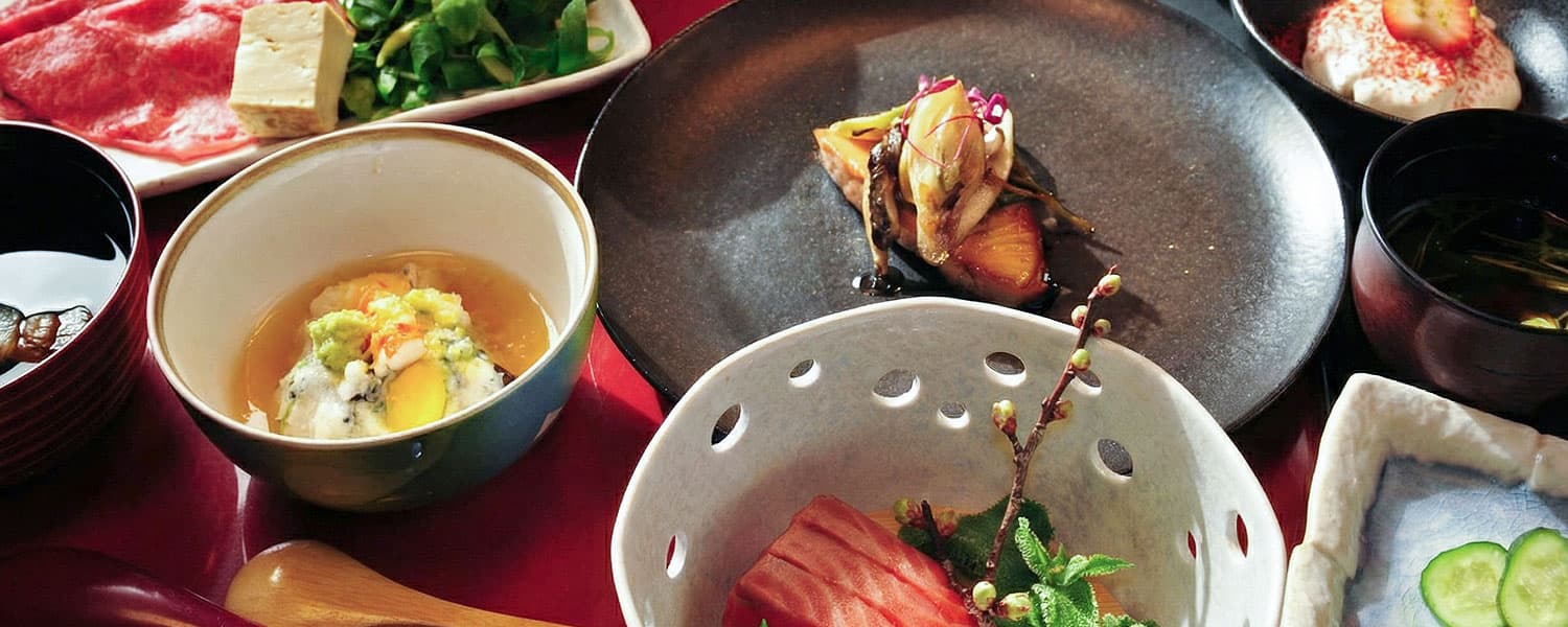 Kaiseki dinner spread with sashimi, simmered dishes and seasonal sides at Yumoto Itaya