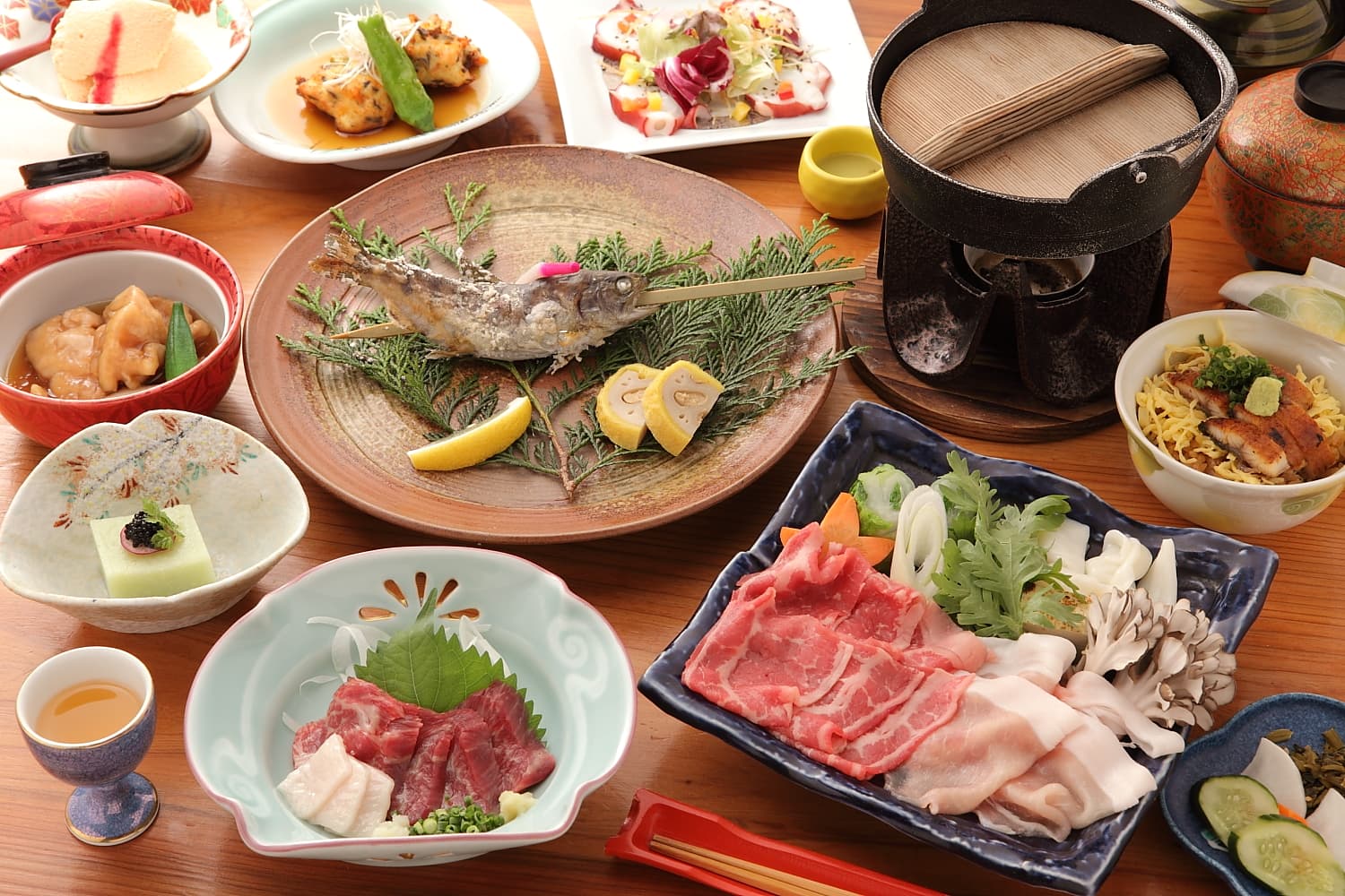 Ryokan Yamanoyu kaiseki dinner spread with grilled river fish, basashi horse sashimi and shabu-shabu