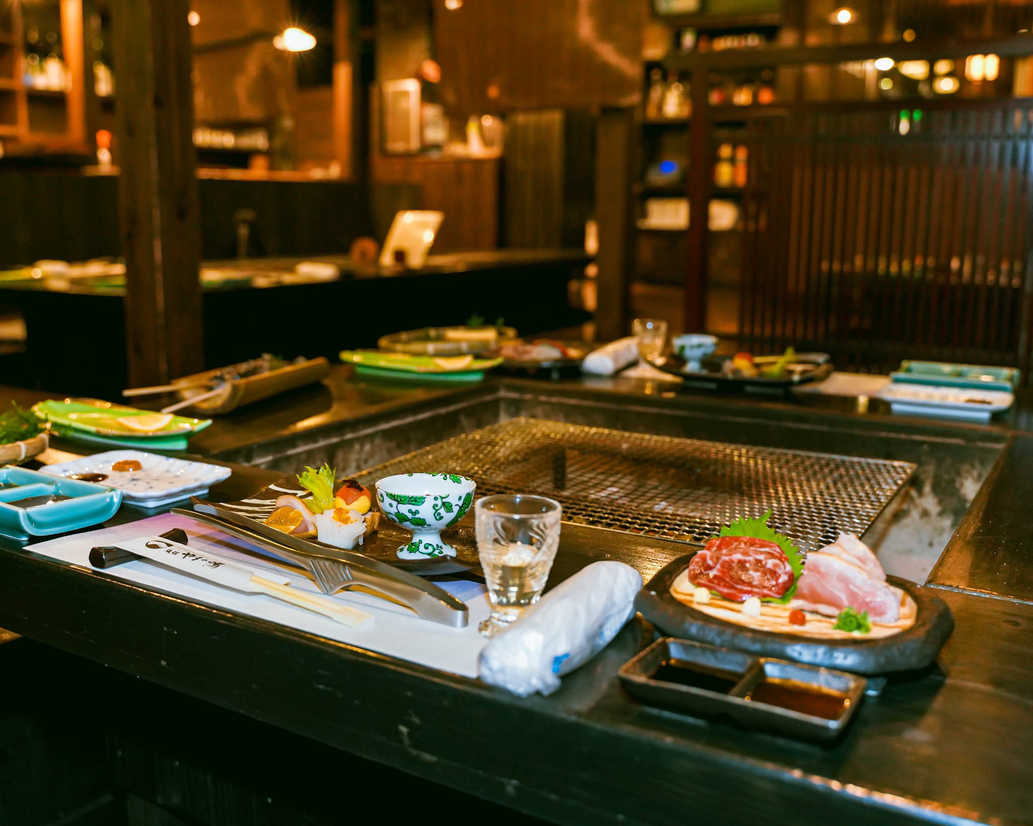 Ryokan Yamanoyu teppanyaki counter dining area with grill and place settings