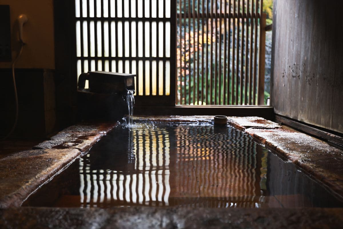 Ryokan Yumotoso stone-walled indoor onsen bath