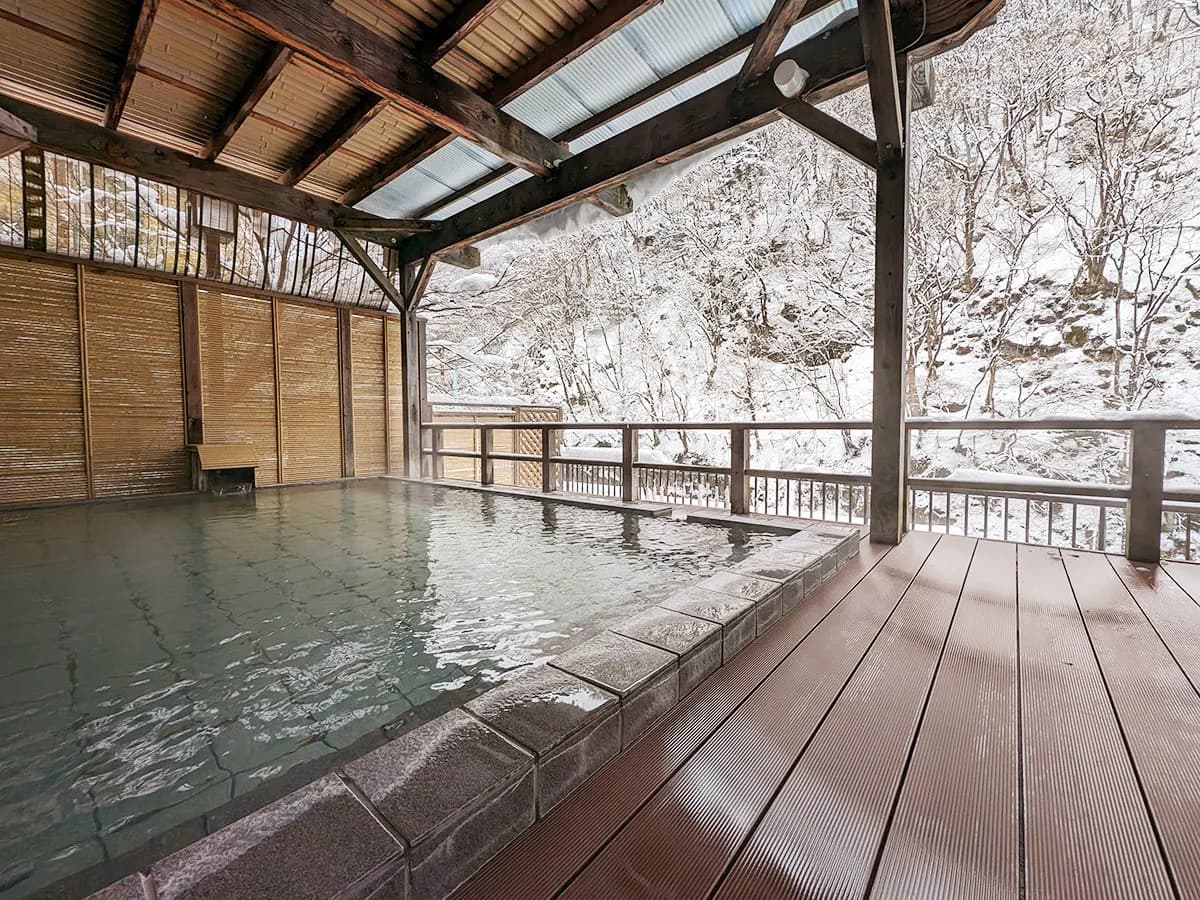 Open-air bath surrounded by snow