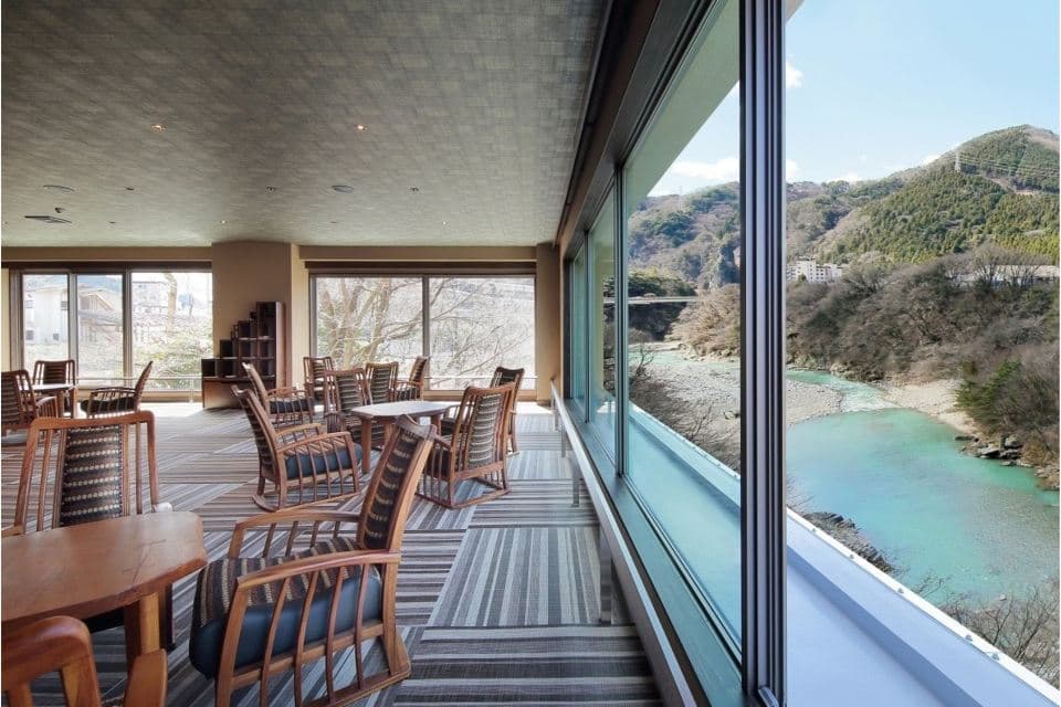 Dining room with tables and forest views