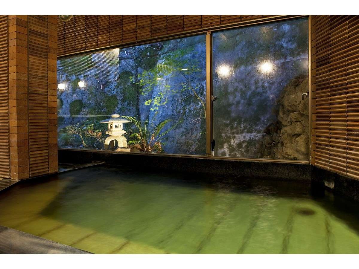 Illuminated night garden viewed from a room at Tsuki no Shizuku