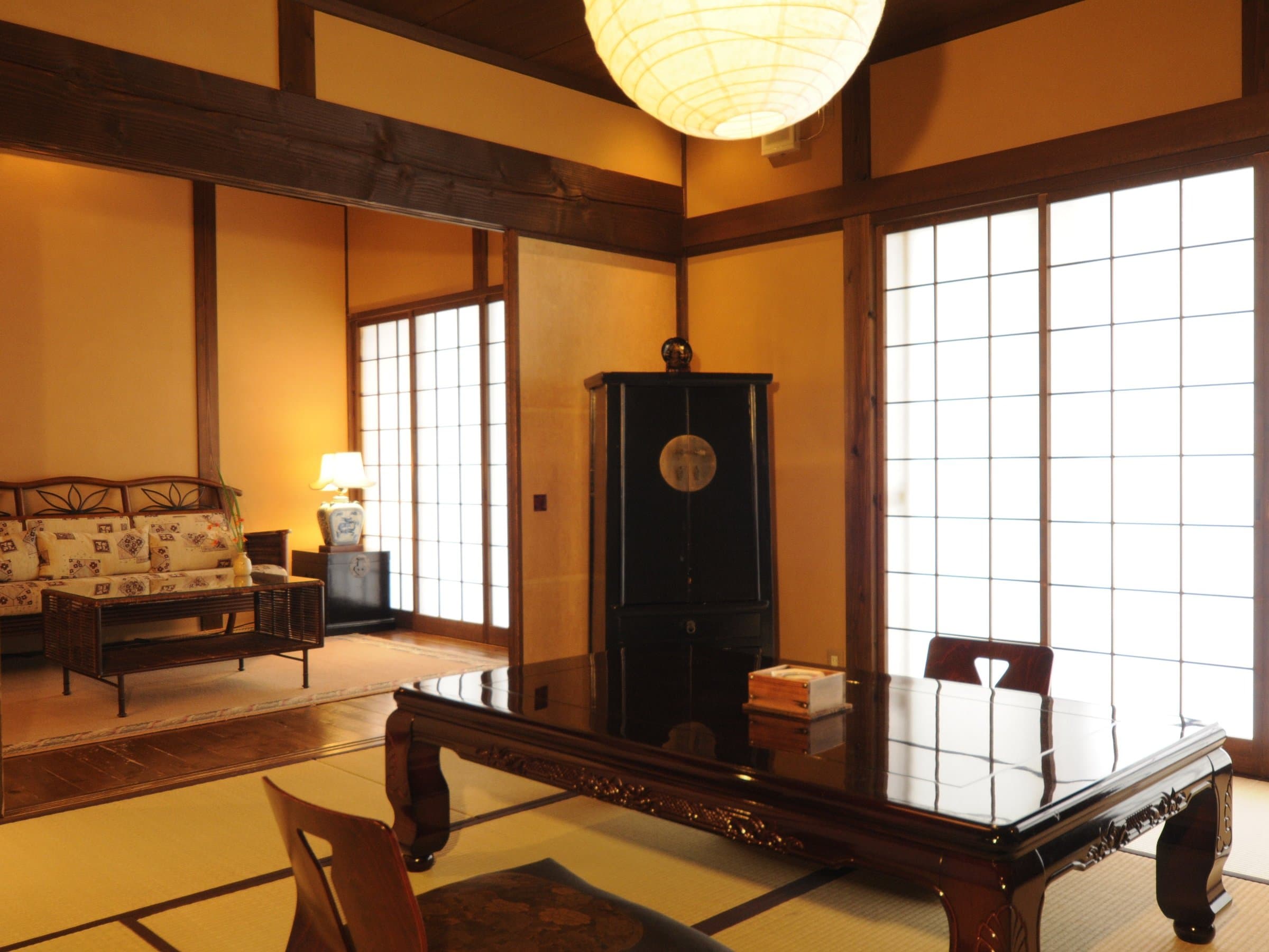 Traditional tatami guest room with shoji screens, lacquered low table and paper lantern at Tsuki no Usagi, Izu