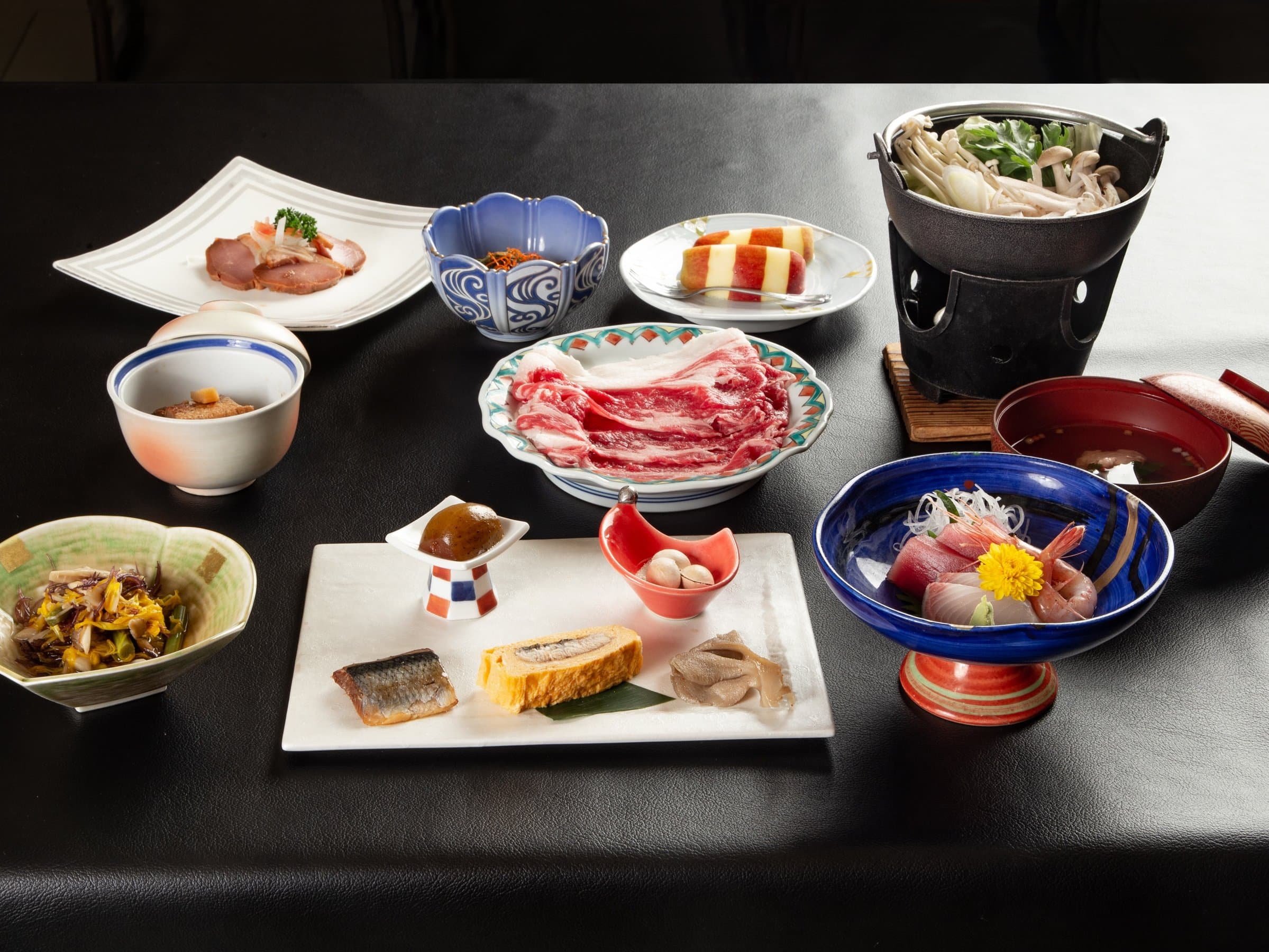 Multi-course kaiseki dinner with sashimi, sukiyaki and small dishes at Zao Plaza Hotel