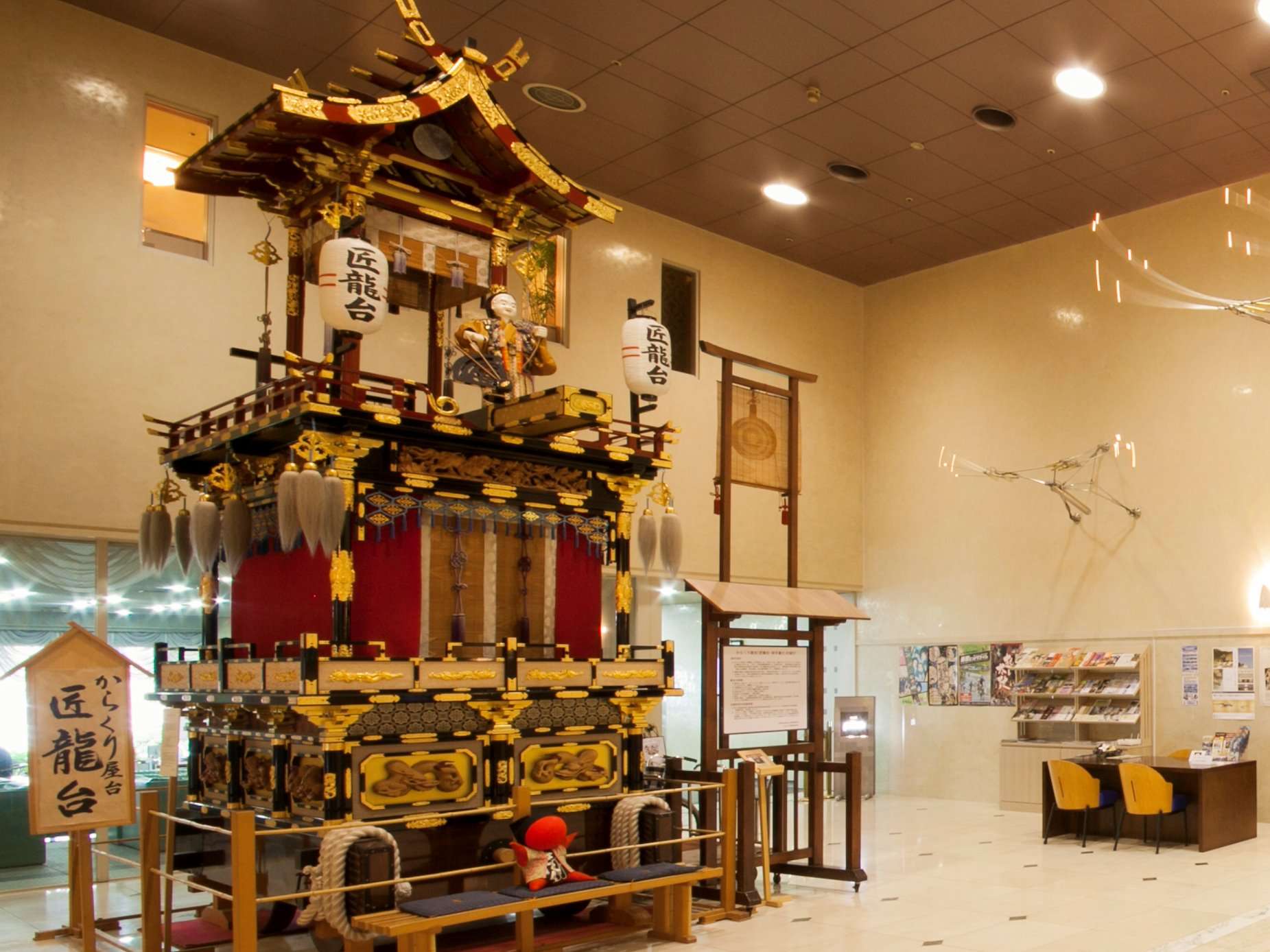 Detail of a gilded Takayama festival float displayed in the lobby of Hida Hotel Plaza