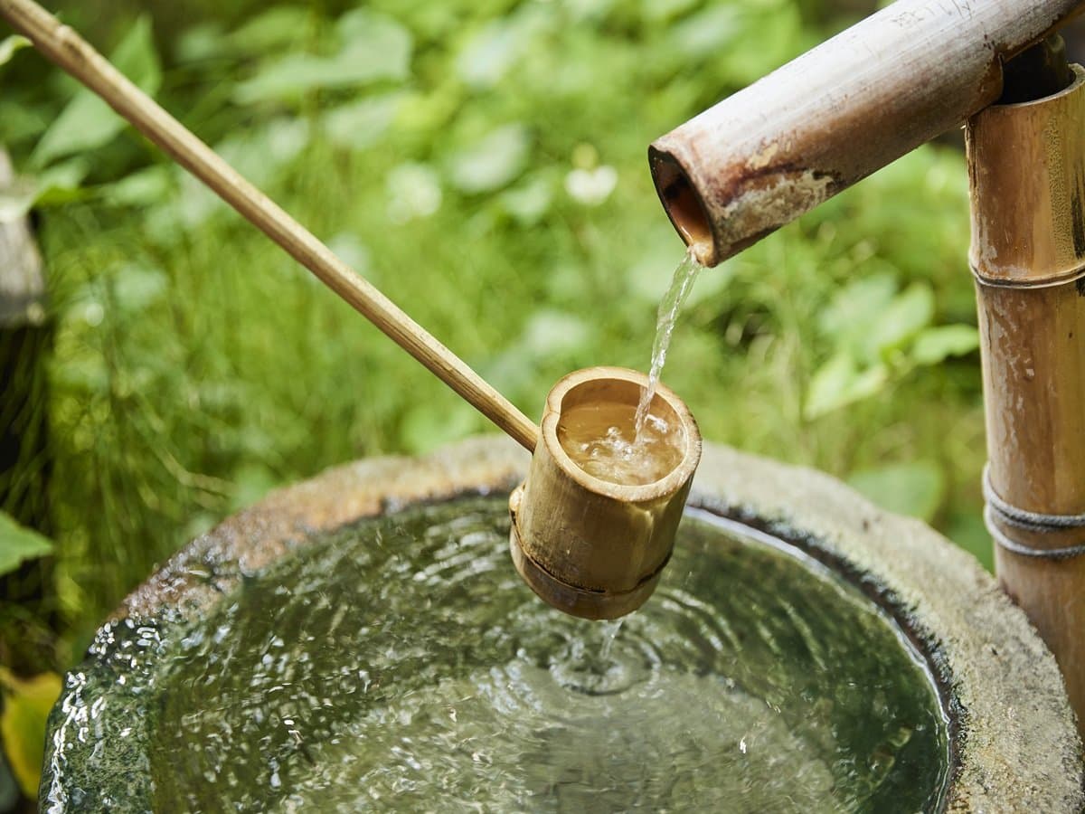 Bamboo tsukubai water basin with ladle, a quiet garden detail