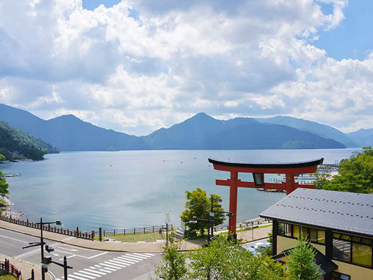 Hotel Hana-An overlooking Lake Chuzenji and the red Futarasan Shrine torii gate in Okunikko