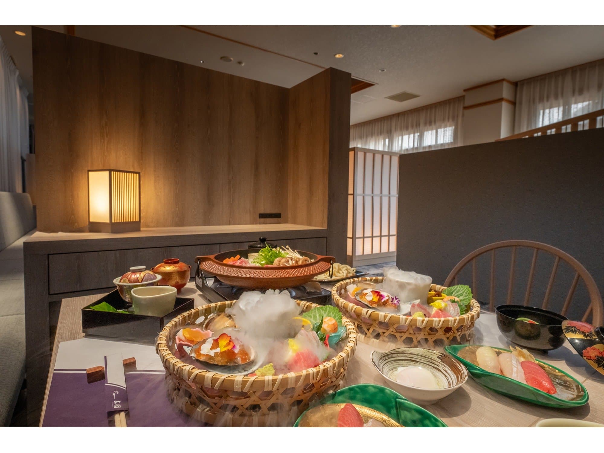 Private dining setting at Unzen Azumaen with hot-pot and seasonal dishes served in woven baskets