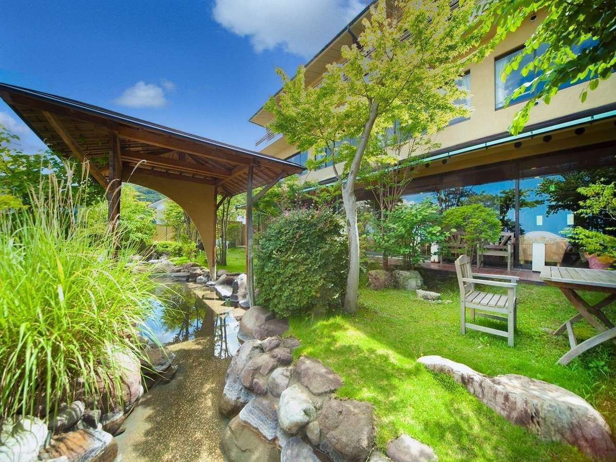 Garden footbath in the central courtyard offering sweeping panoramic views over Beppu Bay, Ryokan Chobonoyado Shiori, Beppu Onsen