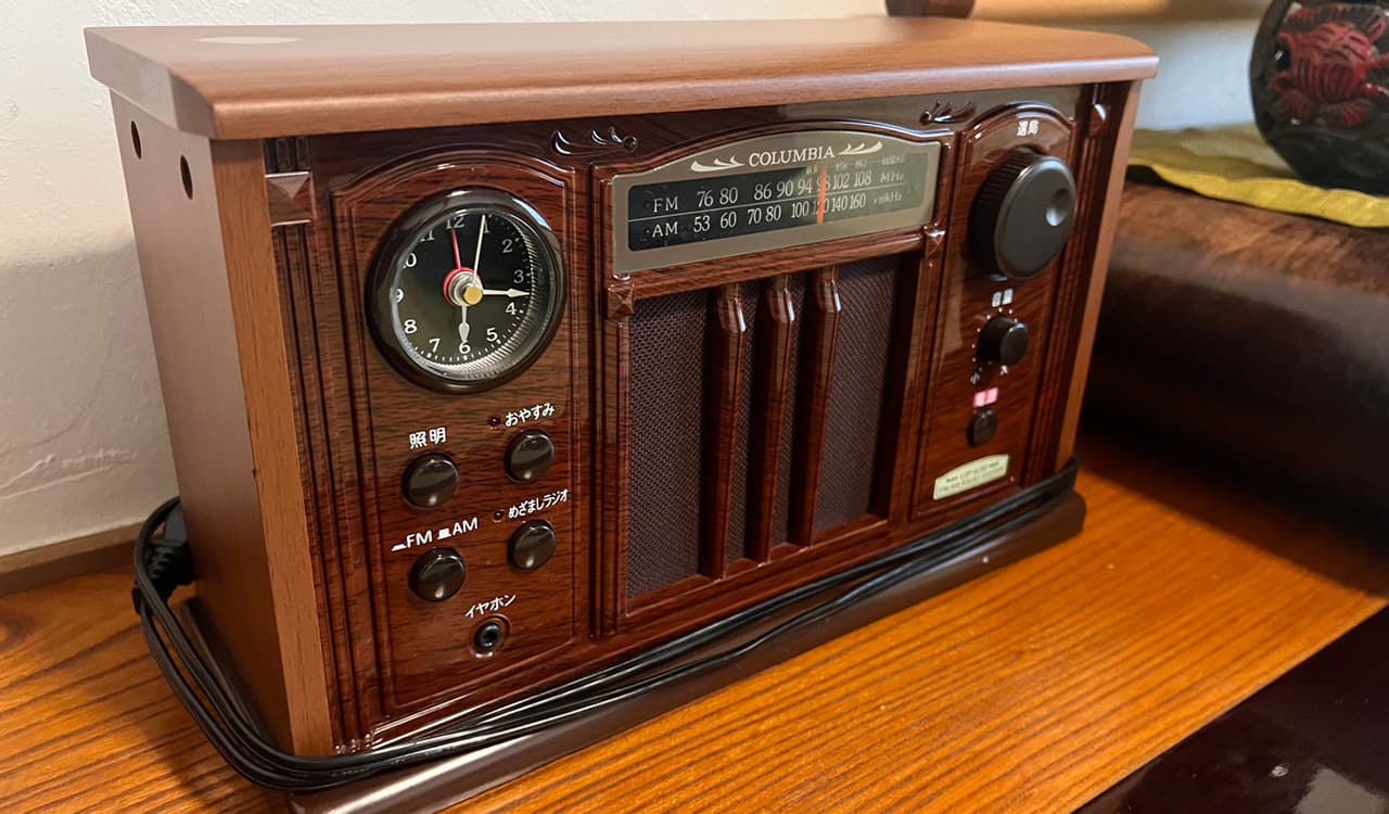 Retro wood-cased clock radio as an in-room amenity detail at Tokiwaso ryokan, Dogo Onsen