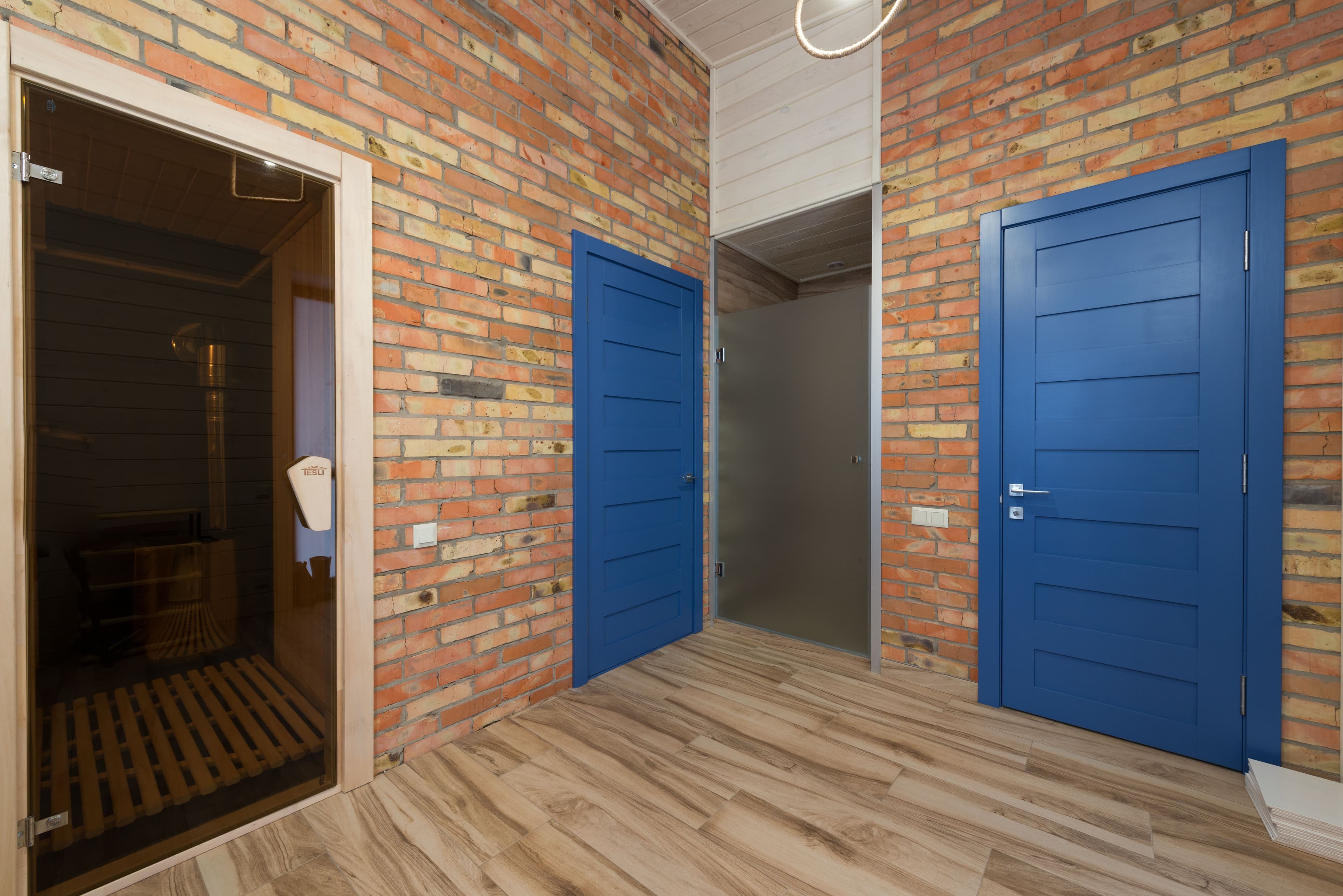 Stylish spa interior with blue architectural elements and modern sauna room design