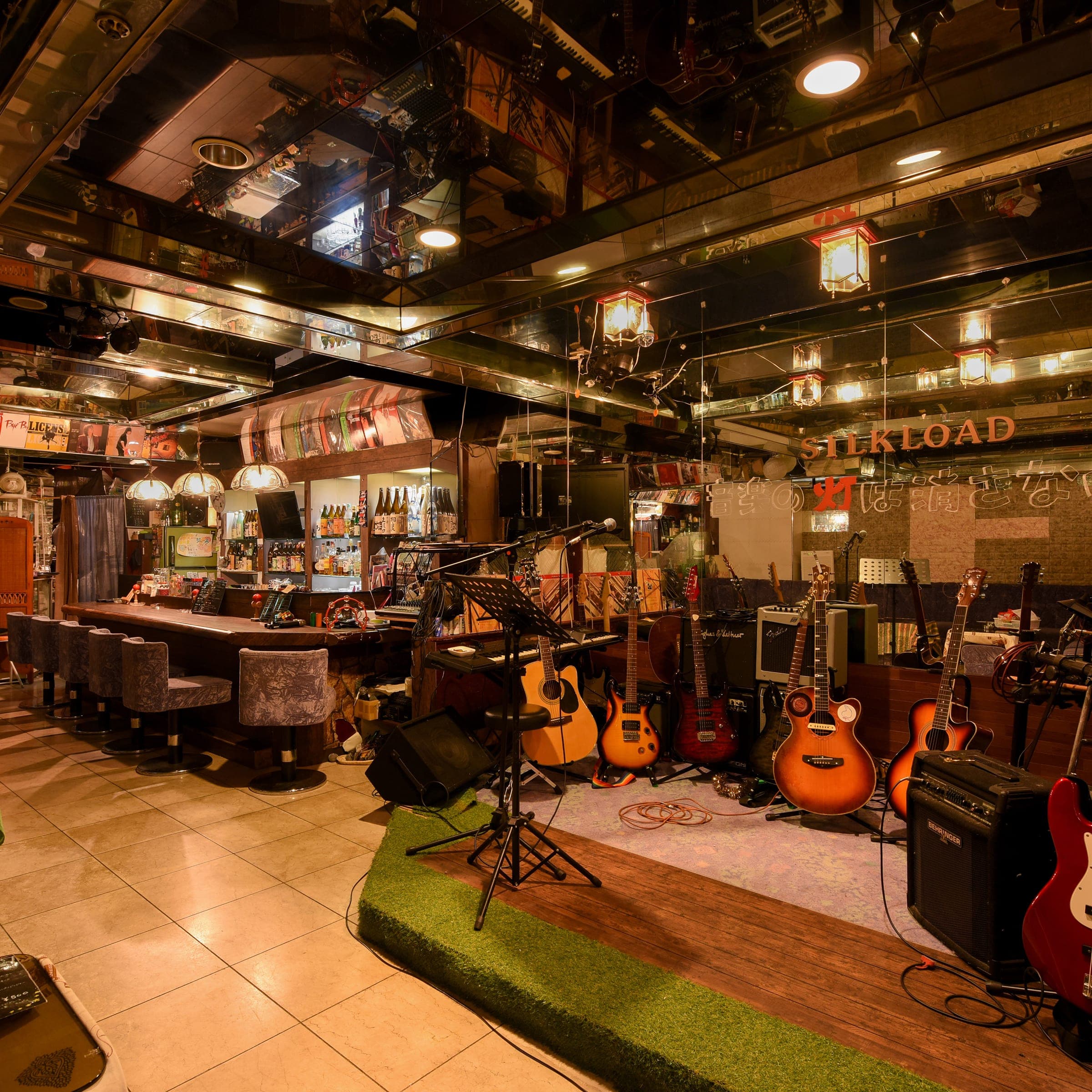 Music bar lounge lined with guitars and amplifiers at Ibusuki Kaijo Hotel in Ibusuki, Kagoshima