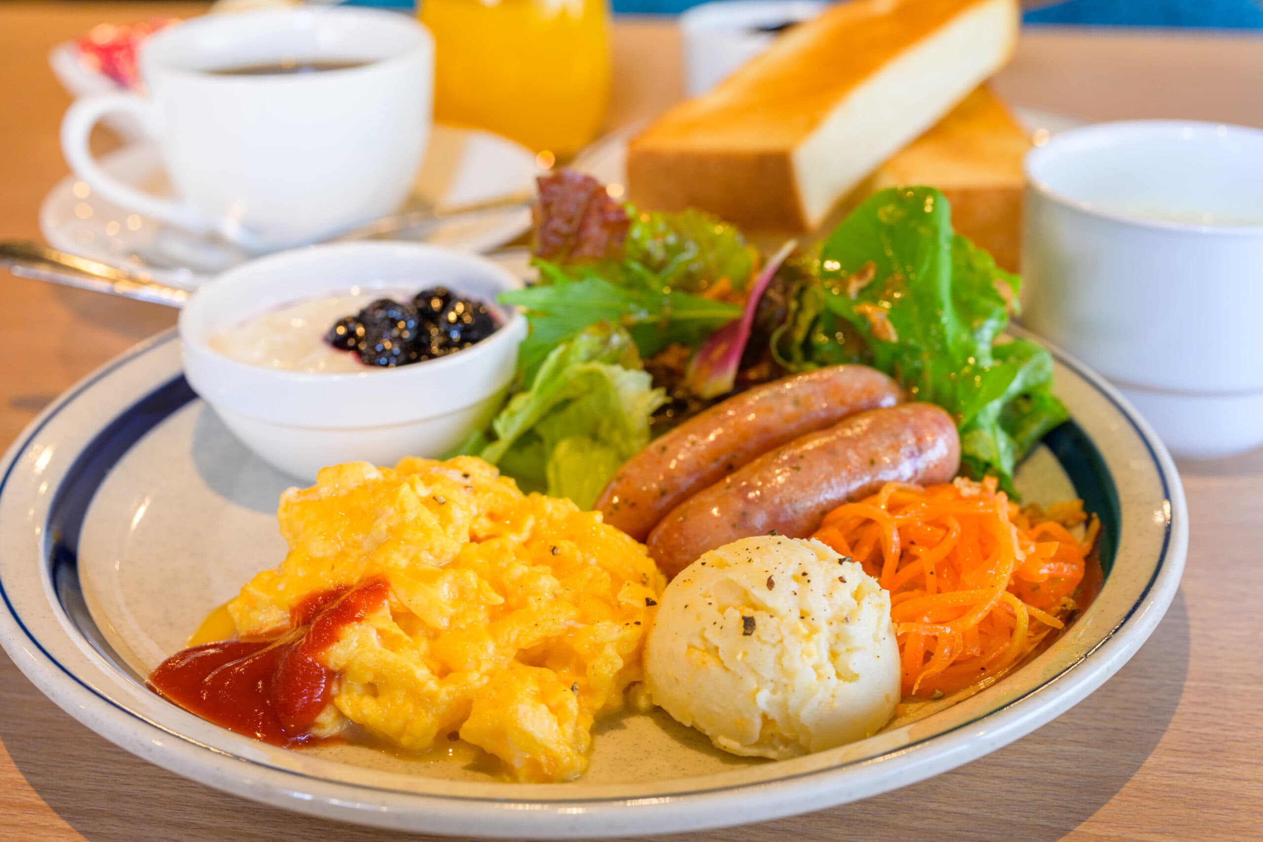 Western-style cafe breakfast plate with scrambled egg, sausage, salad, toast and coffee, Koyado En, Kinosaki Onsen