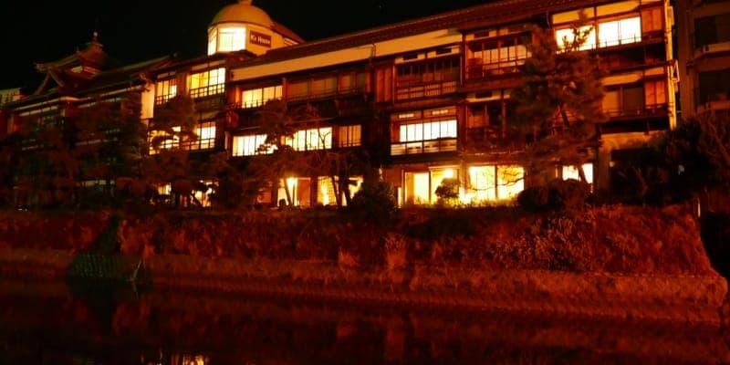 K's House Ito Onsen building exterior at night, 100-year-old Japanese heritage inn