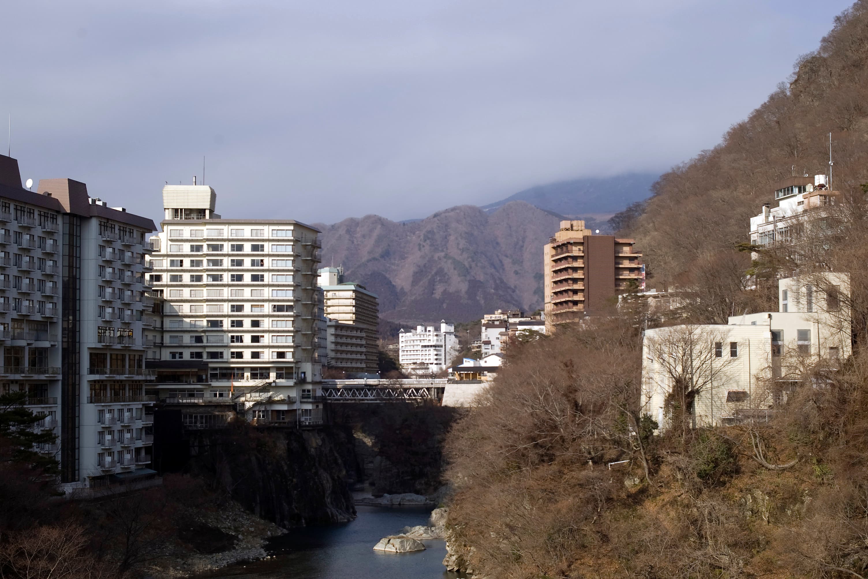 The Kinugawa Onsen river valley — the natural hot-spring resort zone home to Hoshino Resorts KAI Kinugawa and Bettei Sasane, two of the picks in this guide.
