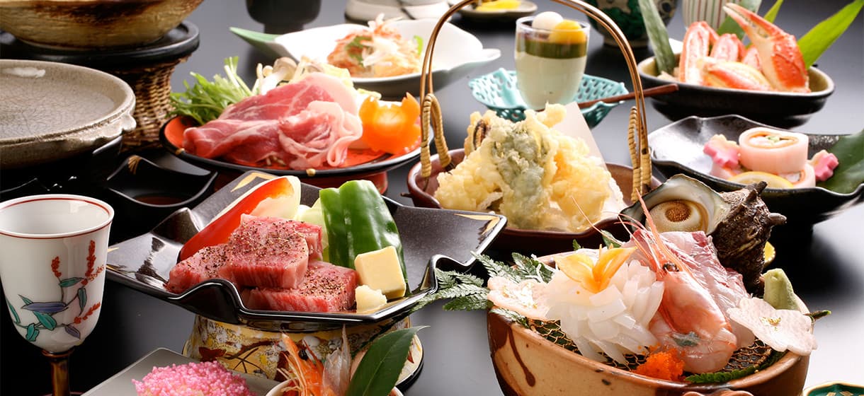 Multi-course kaiseki dinner spread at Morizuya with Tajima beef, sashimi, tempura and crab in seasonal tableware