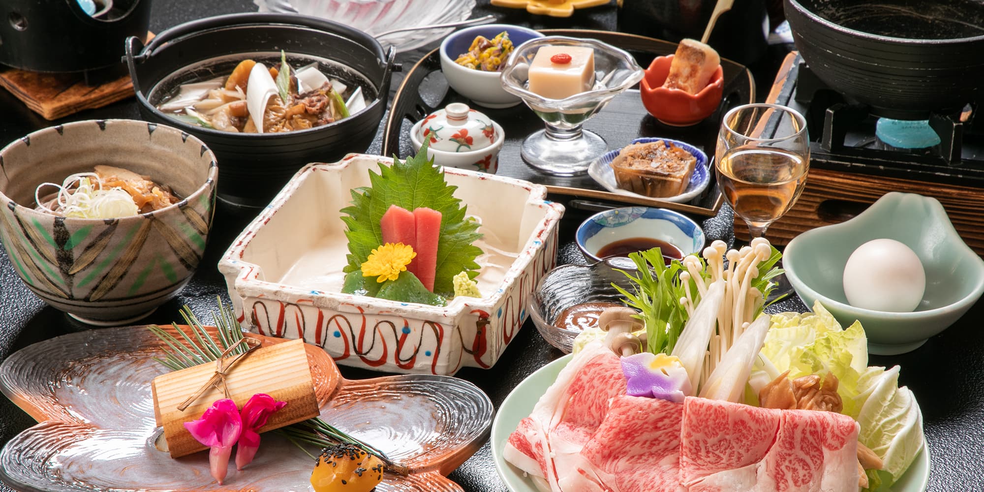 Multi-course kaiseki dinner with sashimi, wagyu beef and seasonal small dishes at Gokan no Yu Tsuruya
